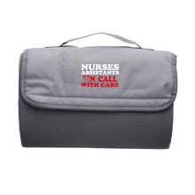 Nurse Assistants Roll Up Picnic Blanket