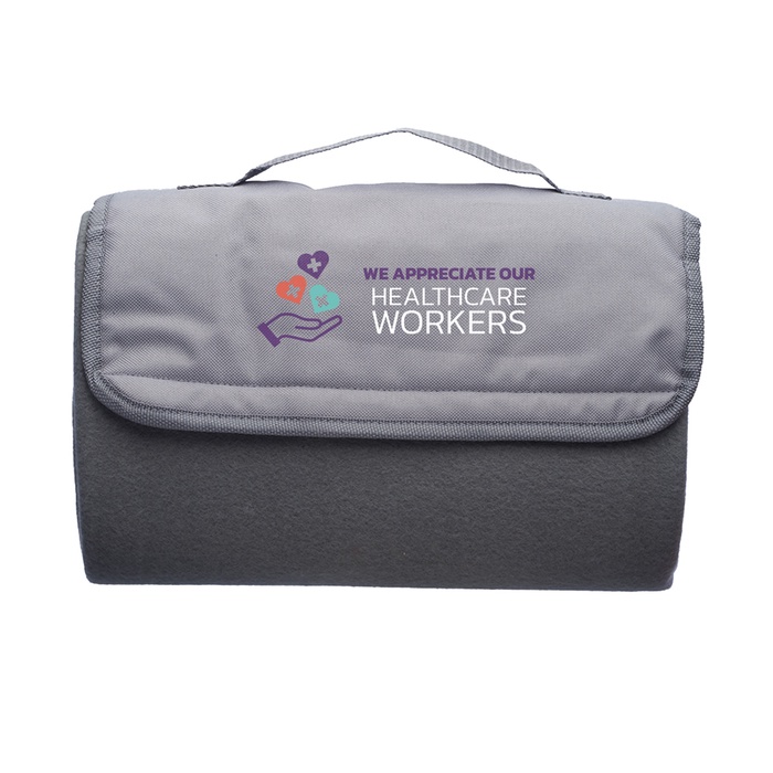 Healthcare Workers Roll Up Picnic Blanket