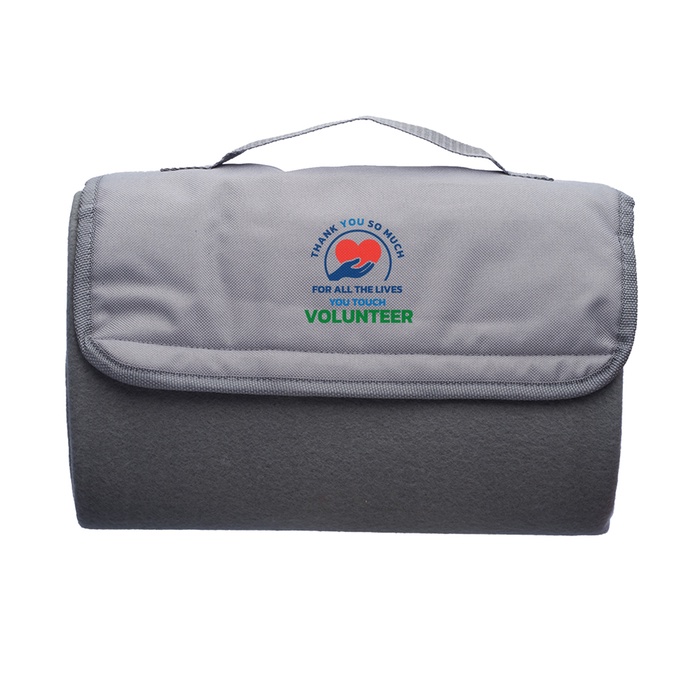 Volunteers Roll Up Picnic Blanket